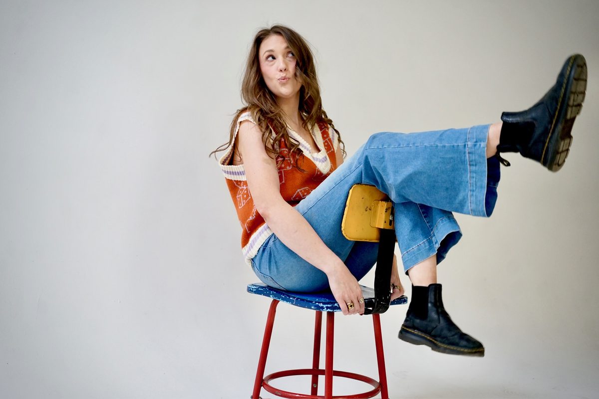 Alise McCreary, founder of Studio Jam, kicking back on a stool