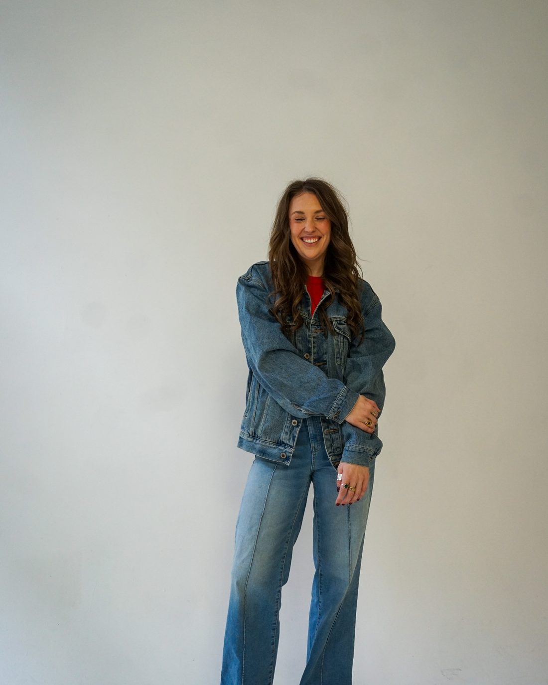 Alise McCreary standing on a block in a denim jacket